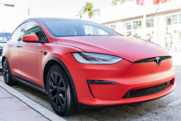 Miami, Florida, USA - December 06, 2024: Tesla X electric crossover car. Electric car of Tesla X type. Car Tesla X parked outdoor. Electric Tesla X, corner view.