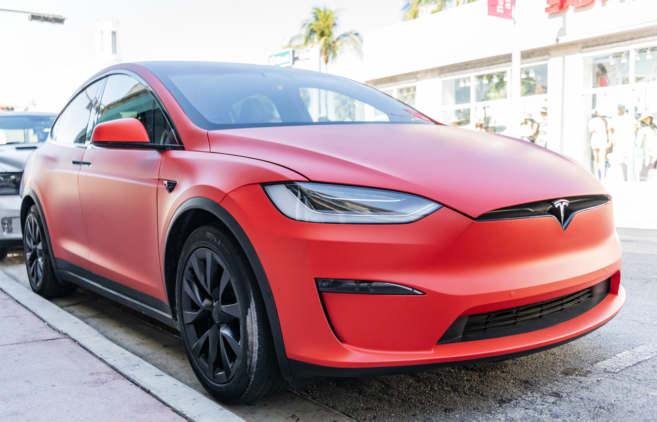 Miami, Florida, USA - December 06, 2024: Tesla X electric crossover car. Electric car of Tesla X type. Car Tesla X parked outdoor. Electric Tesla X, corner view.